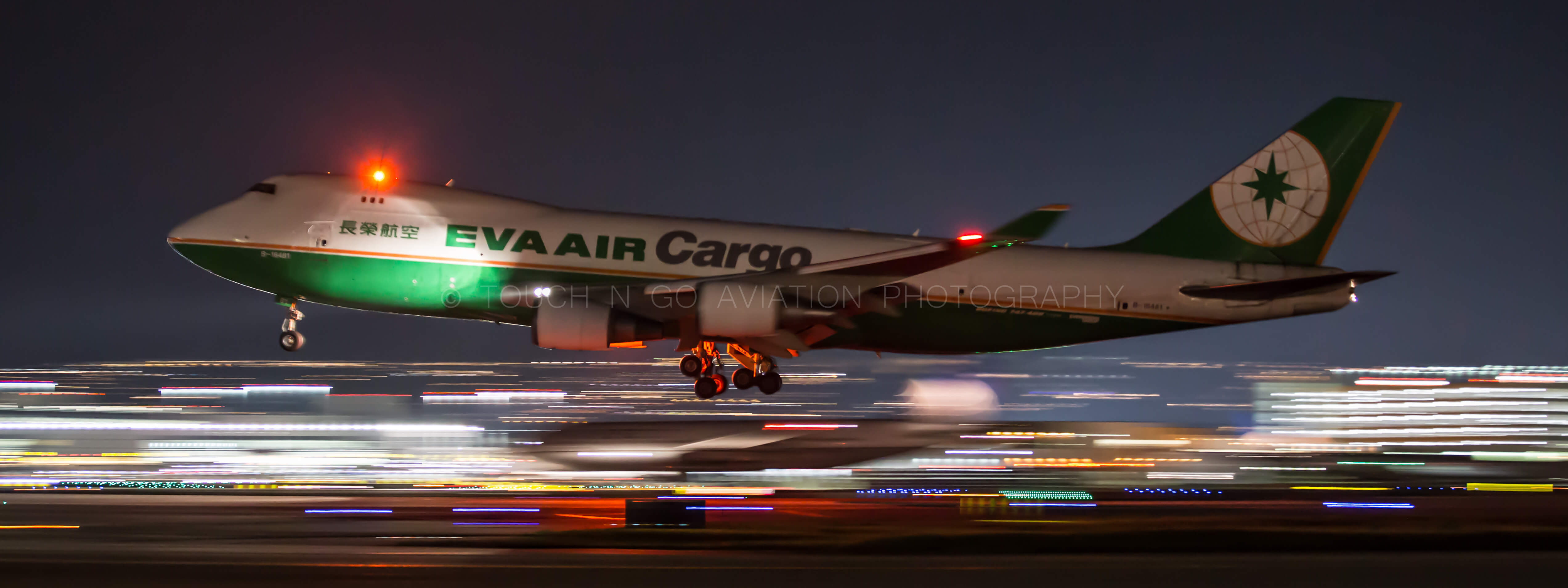 Pan shot of Eva Air 747 nighttime departure from SFO.