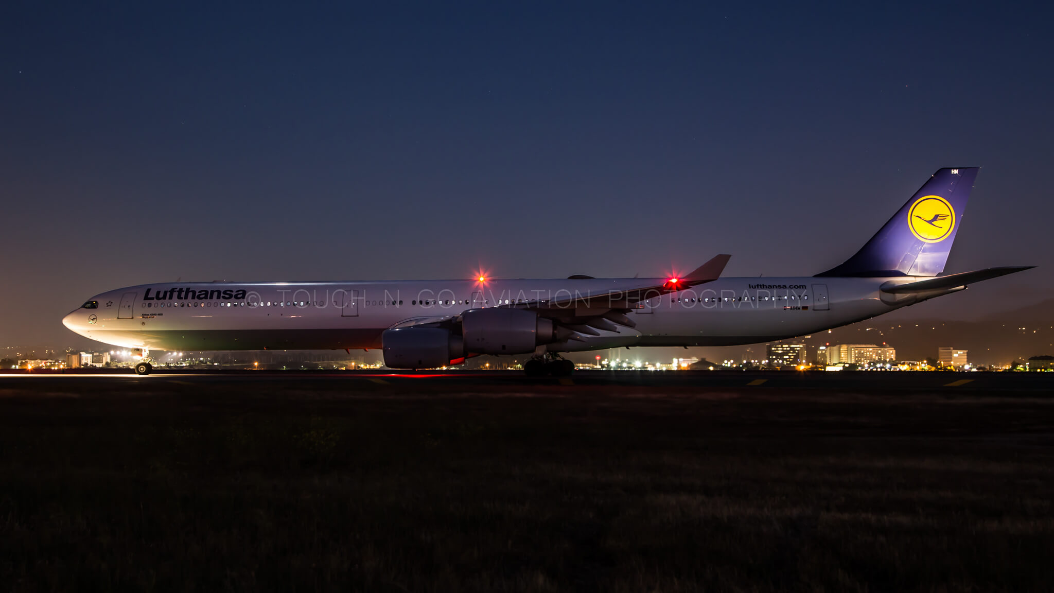 Night shot of Lufthansa A340 bound for Munich out of SFO.
