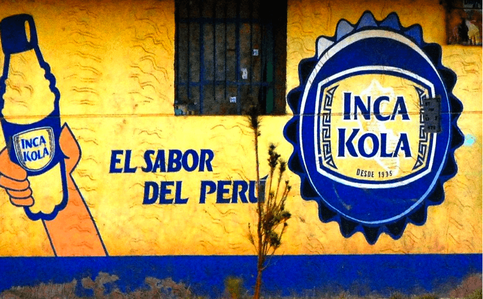 Inca Kola advertisement on side of building in Peru