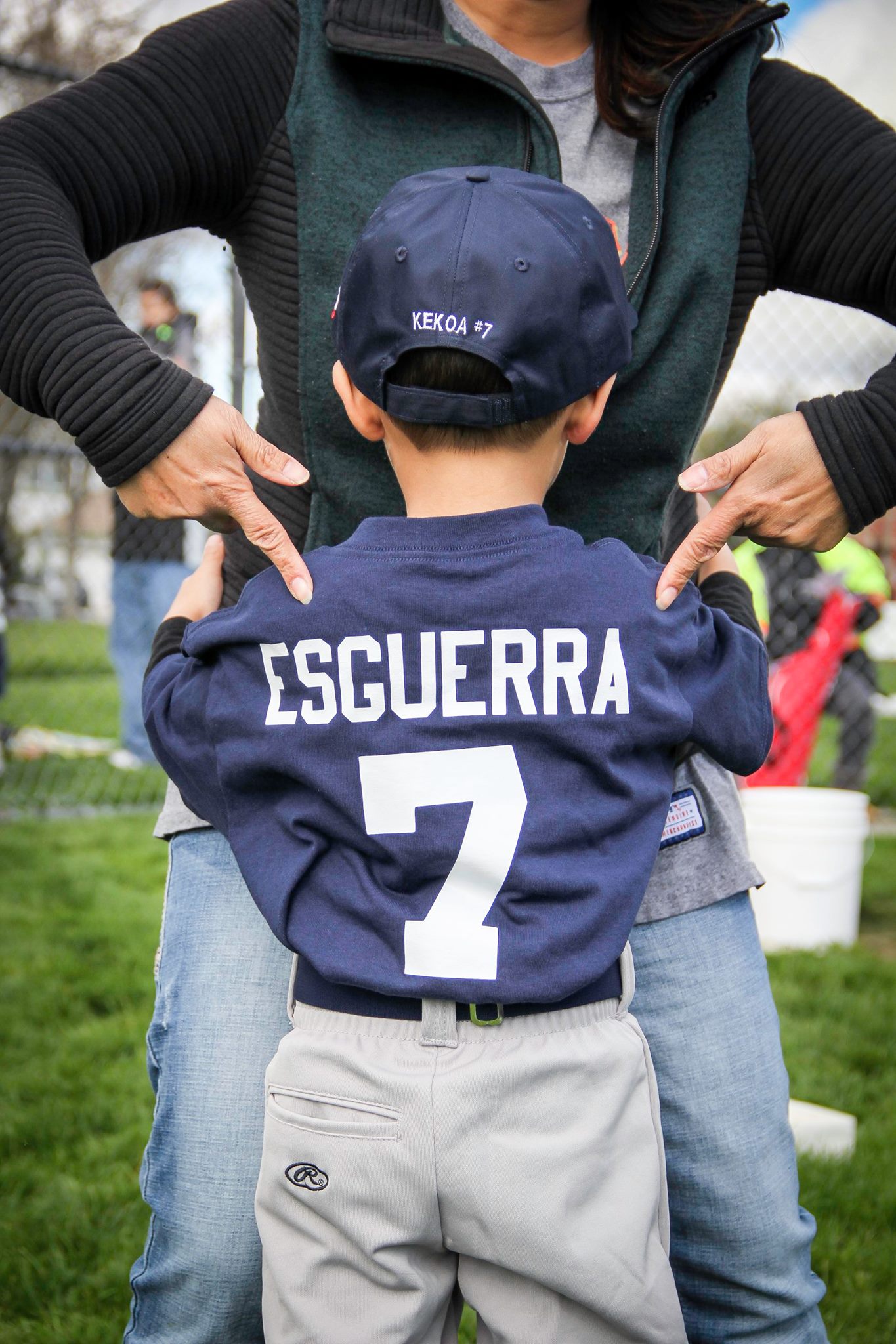 Kekoa showing off the backside of his baseball shirt